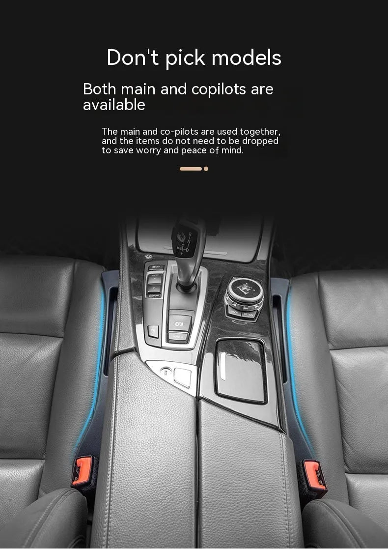 Black car seat gap storage box organiser with compartments and carrying handle between vehicle seats