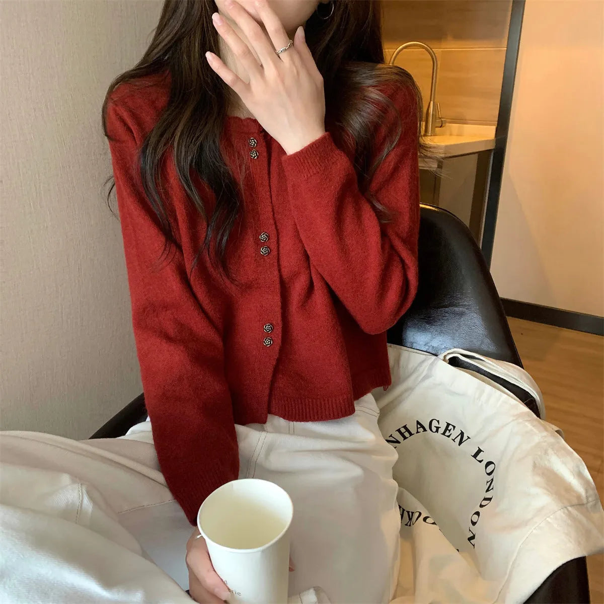 Women's milky white long sleeve acrylic cardigan sweater worn open, showing free size fit and regular sleeve design.