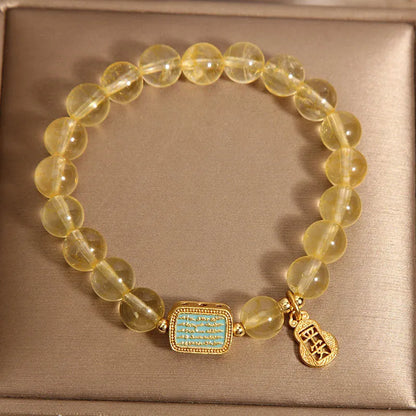 Women's natural yellow citrine crystal bracelet with rhinestone detailing.