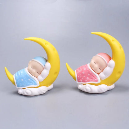 Adorable moon-themed cake decorations and party supplies for baby birthday celebrations