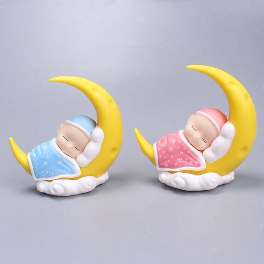 Adorable moon-themed cake decorations and party supplies for baby birthday celebrations