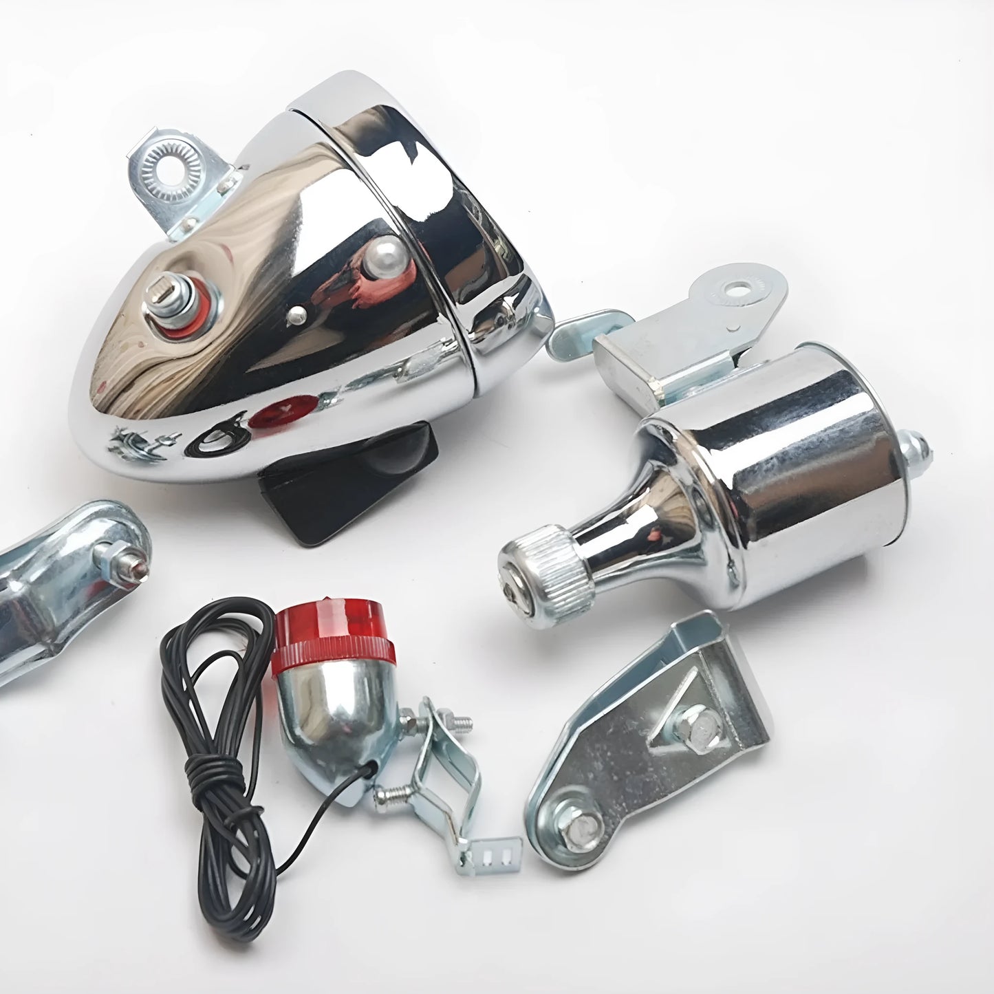 Silver dynamo-powered bicycle light set with generator unit for friction drive on wheel.
