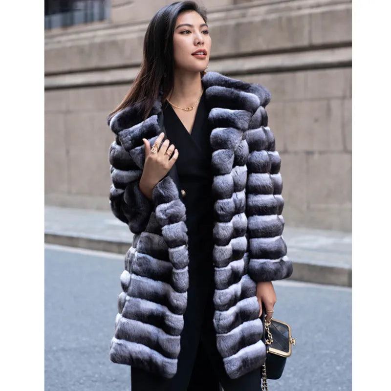 Women's zebra stripe pattern faux fur overcoat with regular sleeves, shown in a medium length.