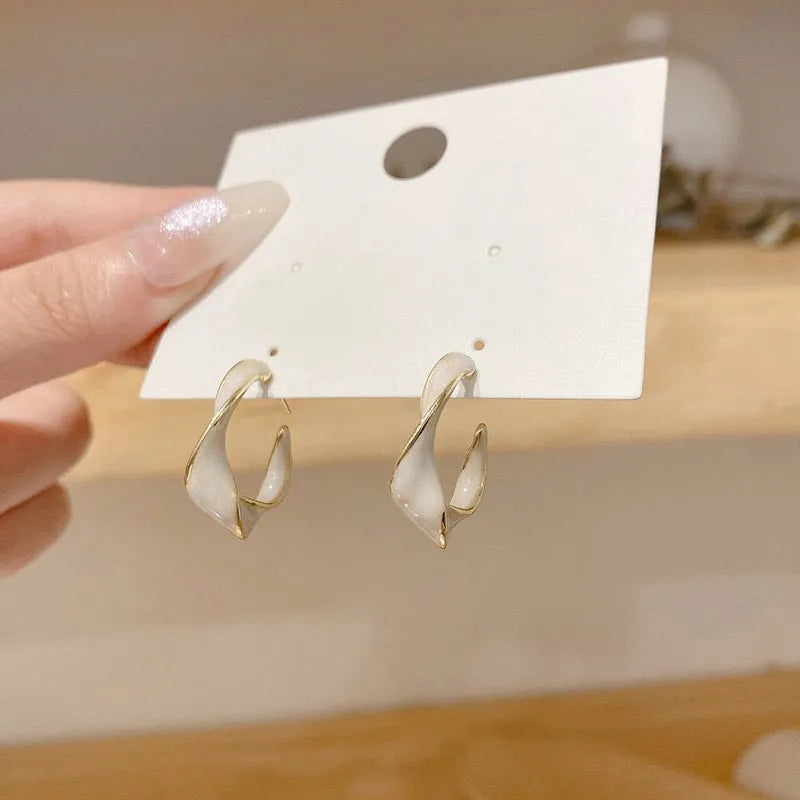 Cream white geometric C-shaped drop oil earrings with electroplated alloy finish in Fashion OL style