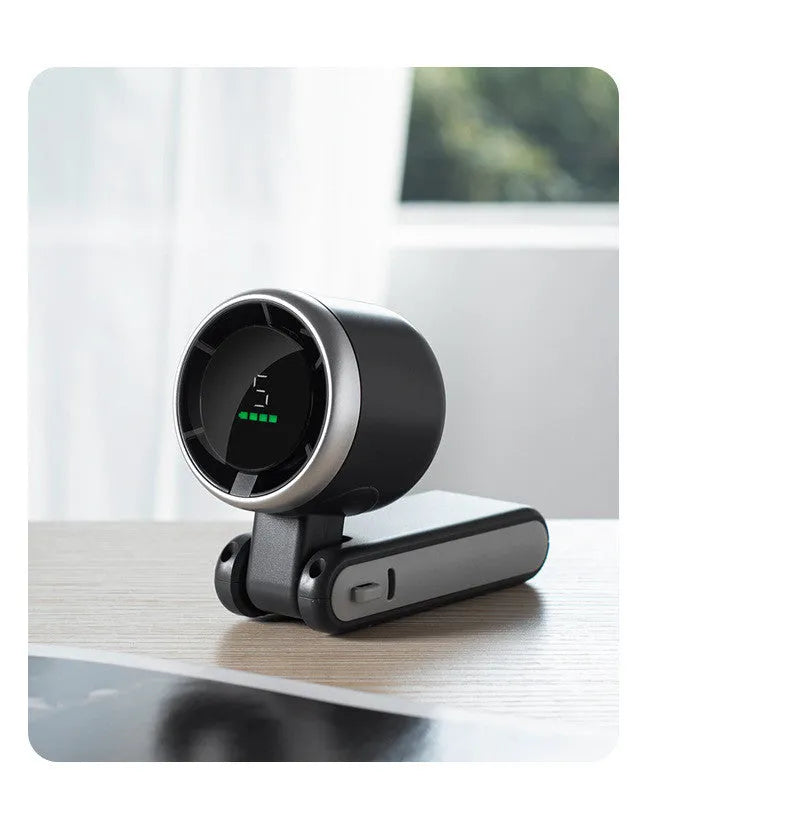 Portable folding mini fan showing adjustable head and compact plastic housing with USB Type-C charging port
