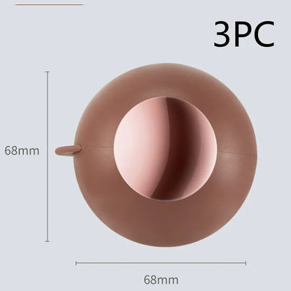 Reusable gel lint roller ball in green gold colour for removing pet hair and lint from fabrics.
