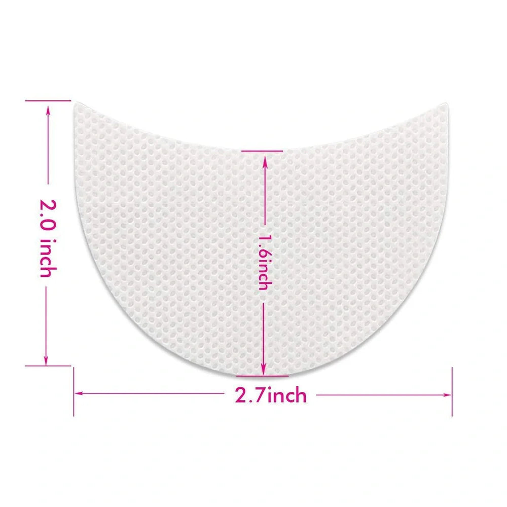 Half-moon shaped under-eye makeup shields on skin during eyeshadow application