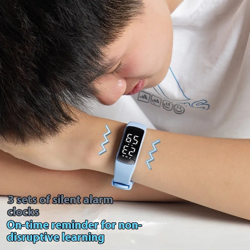 Smart electronic watch with vibration alarm on a silicone strap, showing LED display and 11mm thick case.