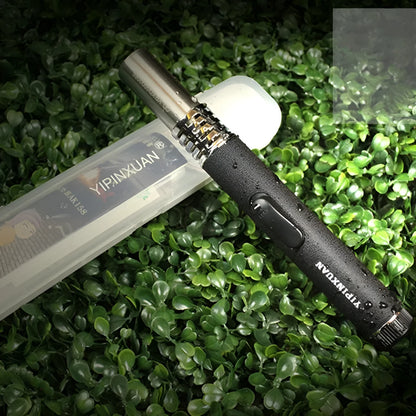 Black portable metal flamethrower with child safety lock for outdoor camping and BBQ use.