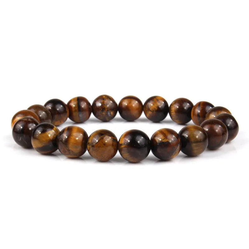 Natural tiger eye crystal bead bracelet showing round geometric beads on a wrist, available in multiple sizes and colour variations.