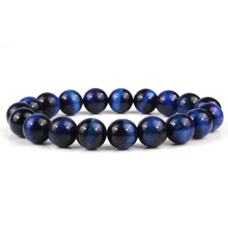 Natural tiger eye crystal bead bracelet showing round geometric beads on a wrist, available in multiple sizes and colour variations.