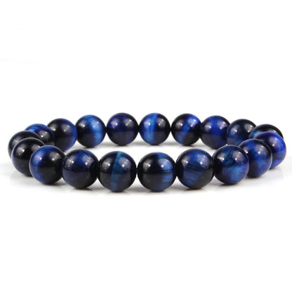Natural tiger eye crystal bead bracelet showing round geometric beads on a wrist, available in multiple sizes and colour variations.