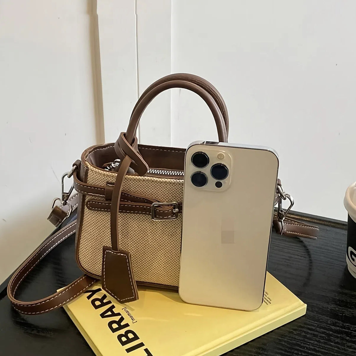 Brown PVC crossbody tote bag with suede lining, single strap, 17.5 x 11.5 x 7.5 cm vertical rectangular shape.