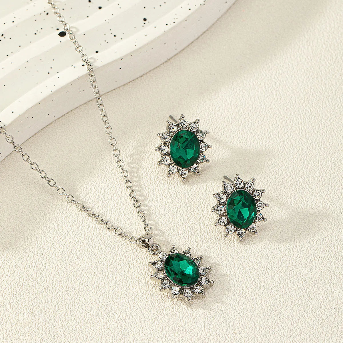 Sunflower zircon necklace and earring set in alloy with electroplated finish showing ellipse-shaped design