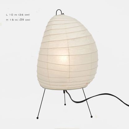 Japanese style table lamp with a white handmade rice paper shade on a slim aluminium base.
