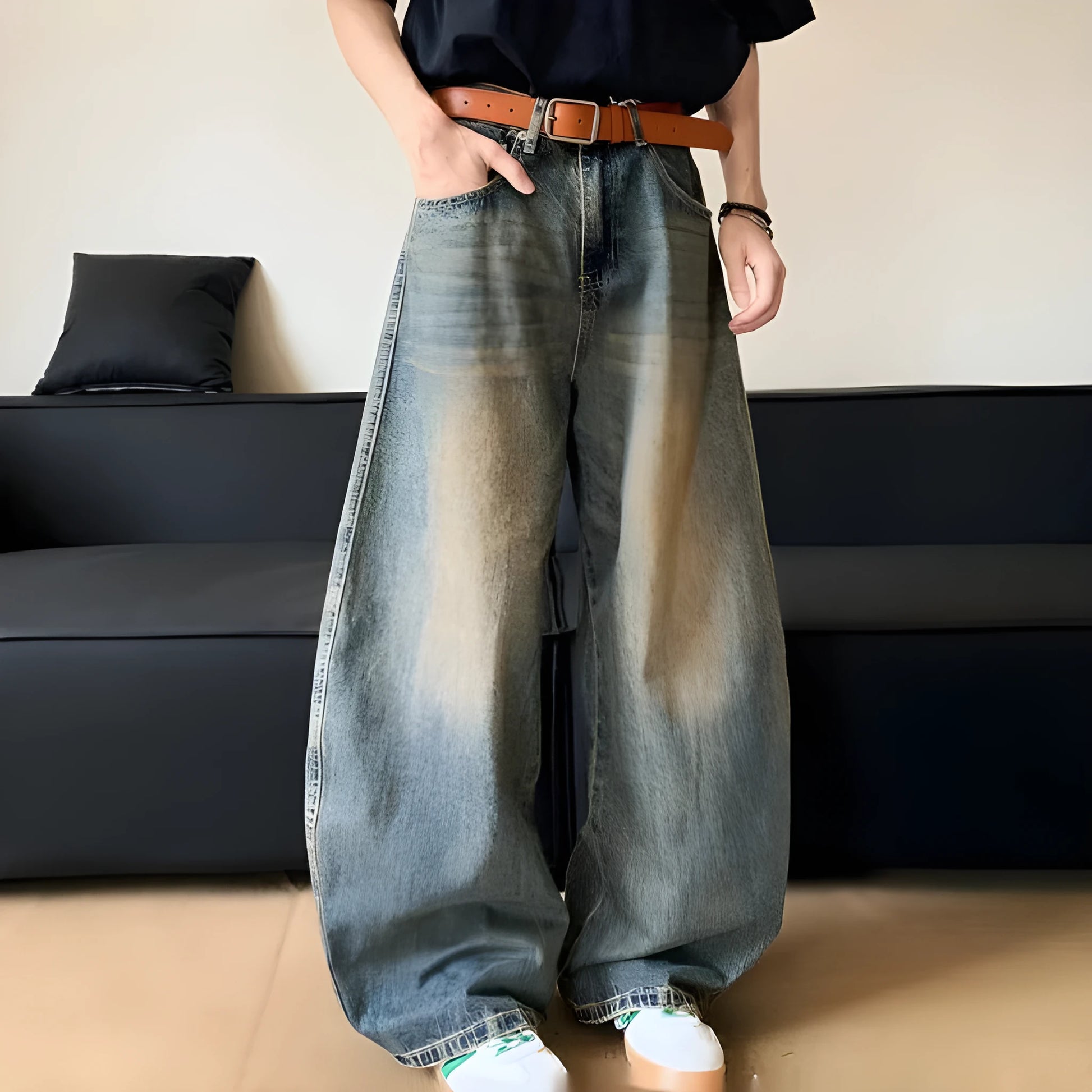 Men's distressed retro blue jeans with a slim wide-leg cut and mid waist.