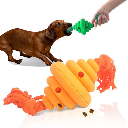 Green and yellow dog ball with attached knotted rope chew and feeder toy on grass.