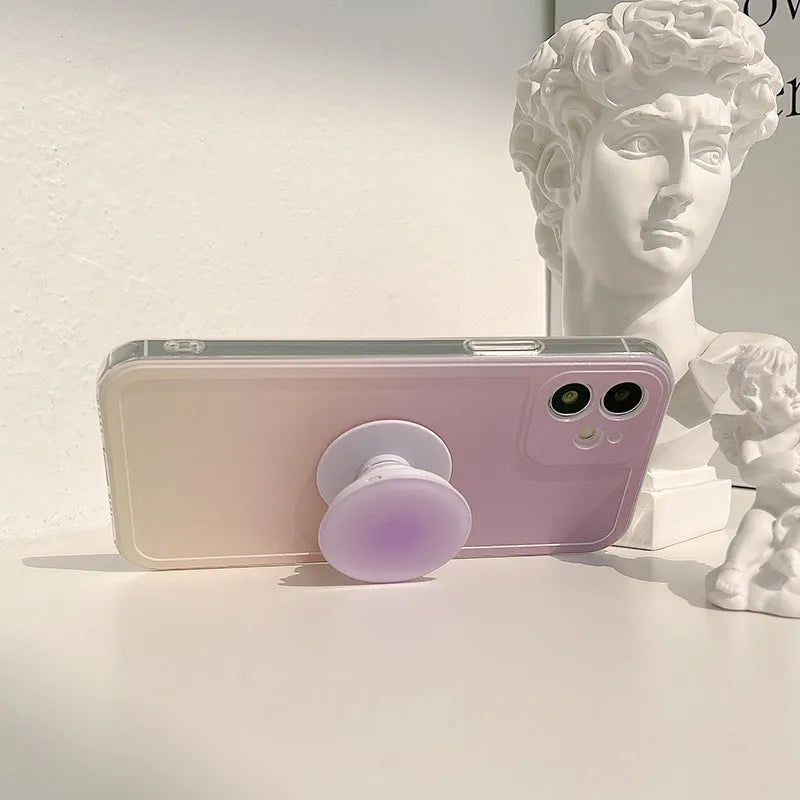 Yellow and purple gradient silicone iPhone case showing integrated airbag X bracket on the back.