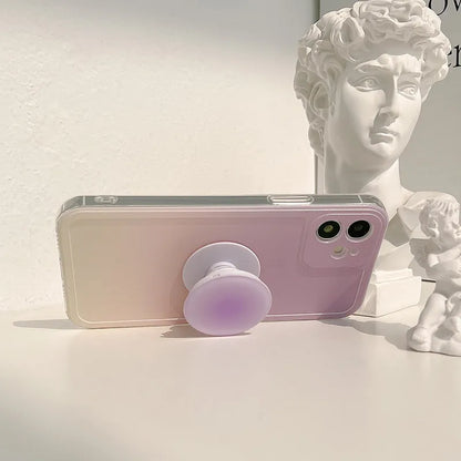 Yellow and purple gradient silicone iPhone case showing integrated airbag X bracket on the back.