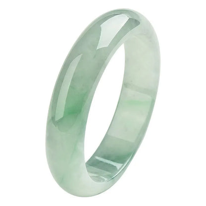 Light green jade stone bracelet showing natural mineral texture on wrist