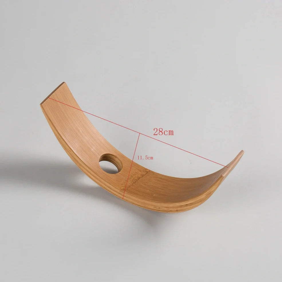 Natural bamboo wine bottle rack holding six bottles with wood grain visible