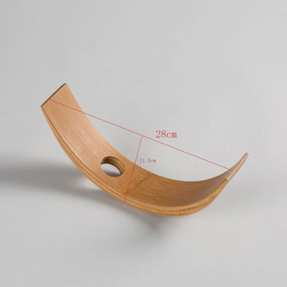 Natural bamboo wine bottle rack holding six bottles with wood grain visible