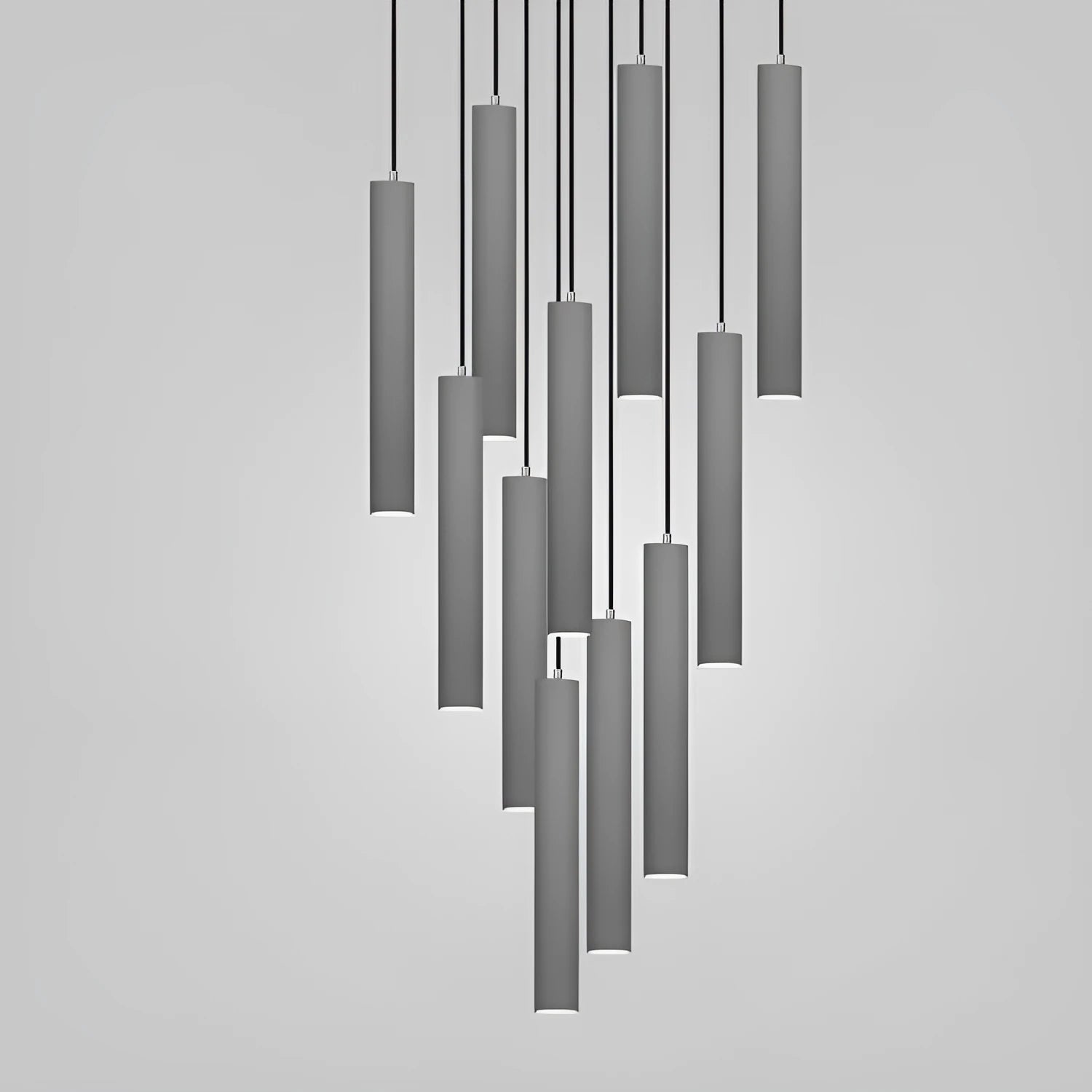 Modern cement rod chandelier with marble body and adjustable suspension hanging from a ceiling