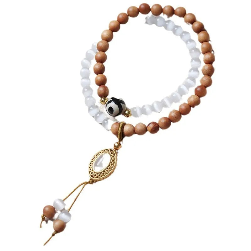 Sandalwood double ring and Opal Tibetan bead bracelet with polished finish
