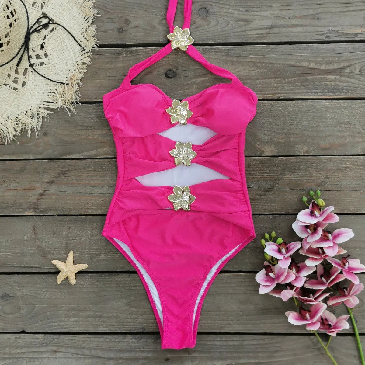Women's solid colour one-piece swimsuit with attached short skirt in black, showing high-waisted fit and hollow-out tube top design.