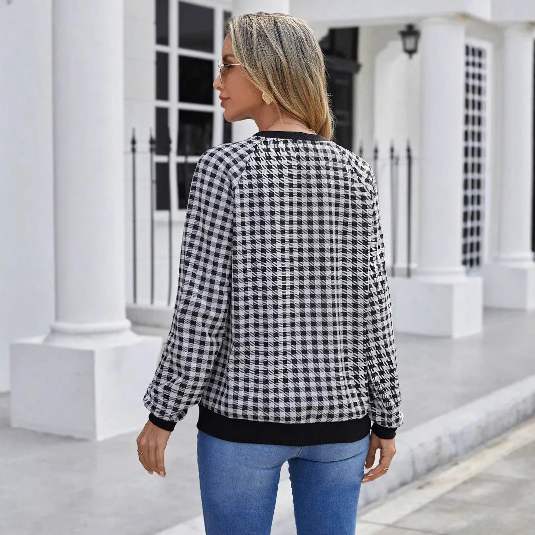 Black plaid pullover sweater with striped pattern and long sleeves, showing printing detail on polyester fabric