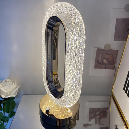 Modern minimalist O-shaped crystal desk lamp with touch dimming control on metal base