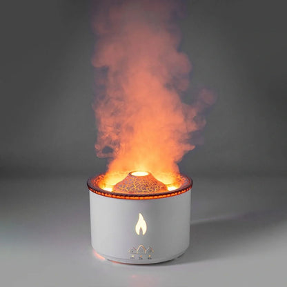 Black columnar ultrasonic humidifier with volcano flame effect and jellyfish smoke rings emerging from mist