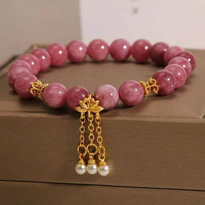 Pink lotus tassel natural stone bracelet with pearl pendant and flower charm.