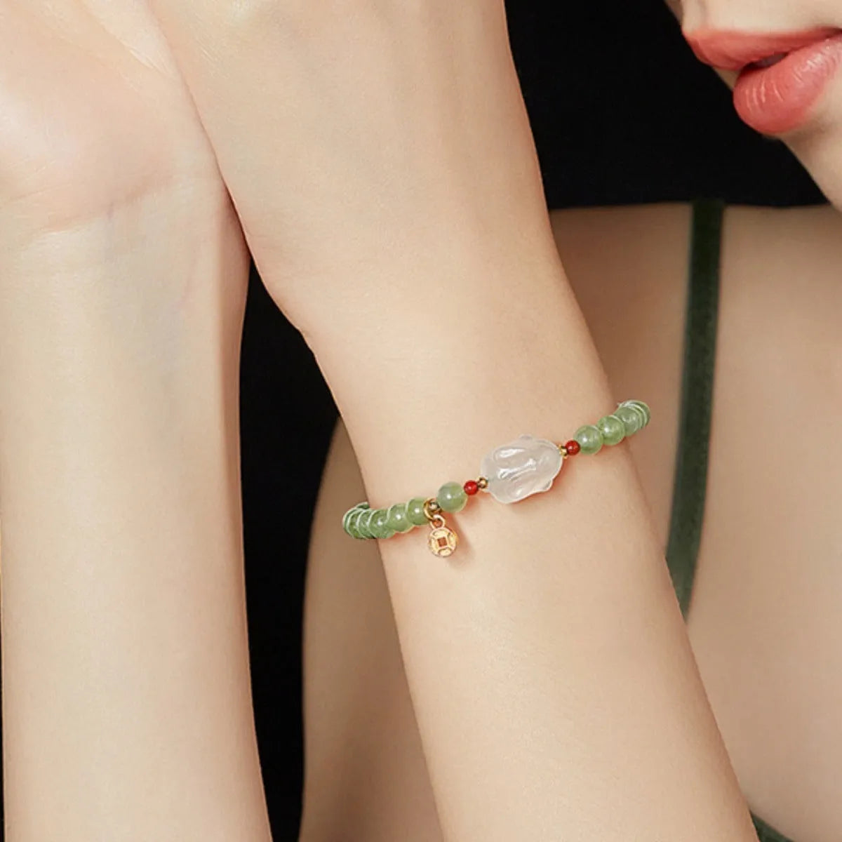 Handmade women's bracelet with a glass rabbit charm on a coloured glaze chain.