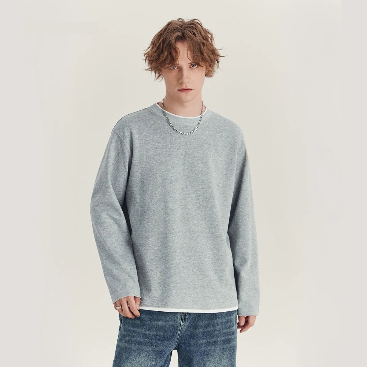 Men's loose long-sleeved cotton blend t-shirt in black, round neck, casual style.