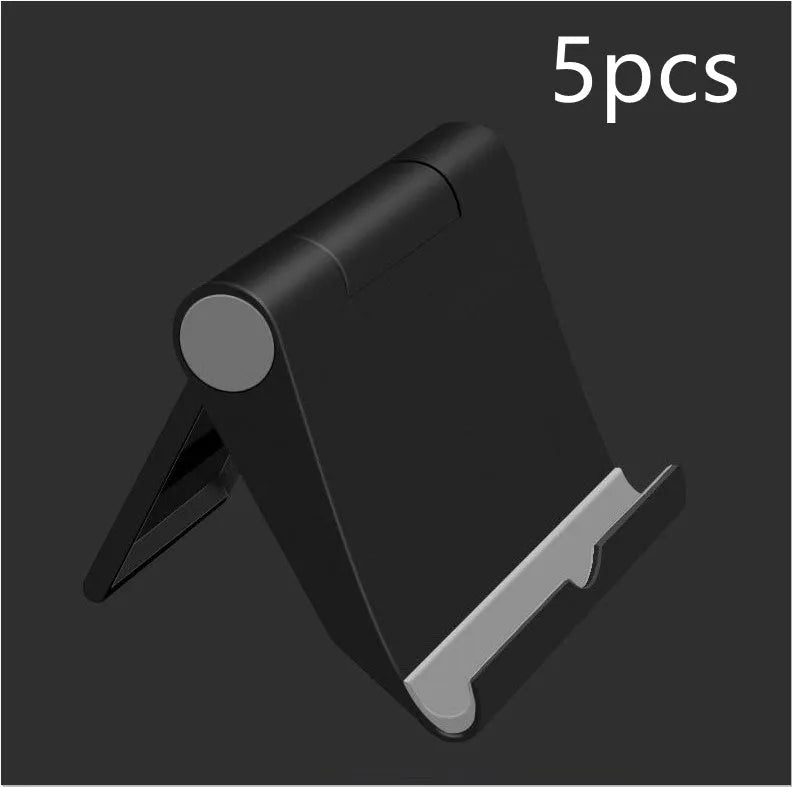 Black PE folding mobile phone stand holding a smartphone at an angle on a desktop.