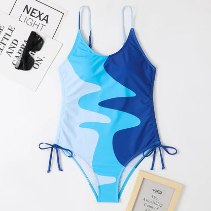 Women's sleeveless one-piece swimsuit in a striped print, shown in blue colour.