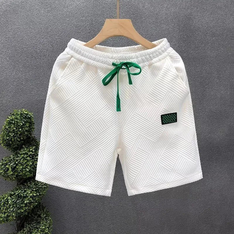 Men's solid colour polyester sports shorts with micro-elasticity, shown in black.