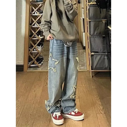 Blue high-waisted wide-leg denim trousers with a straight-leg cut on a model.