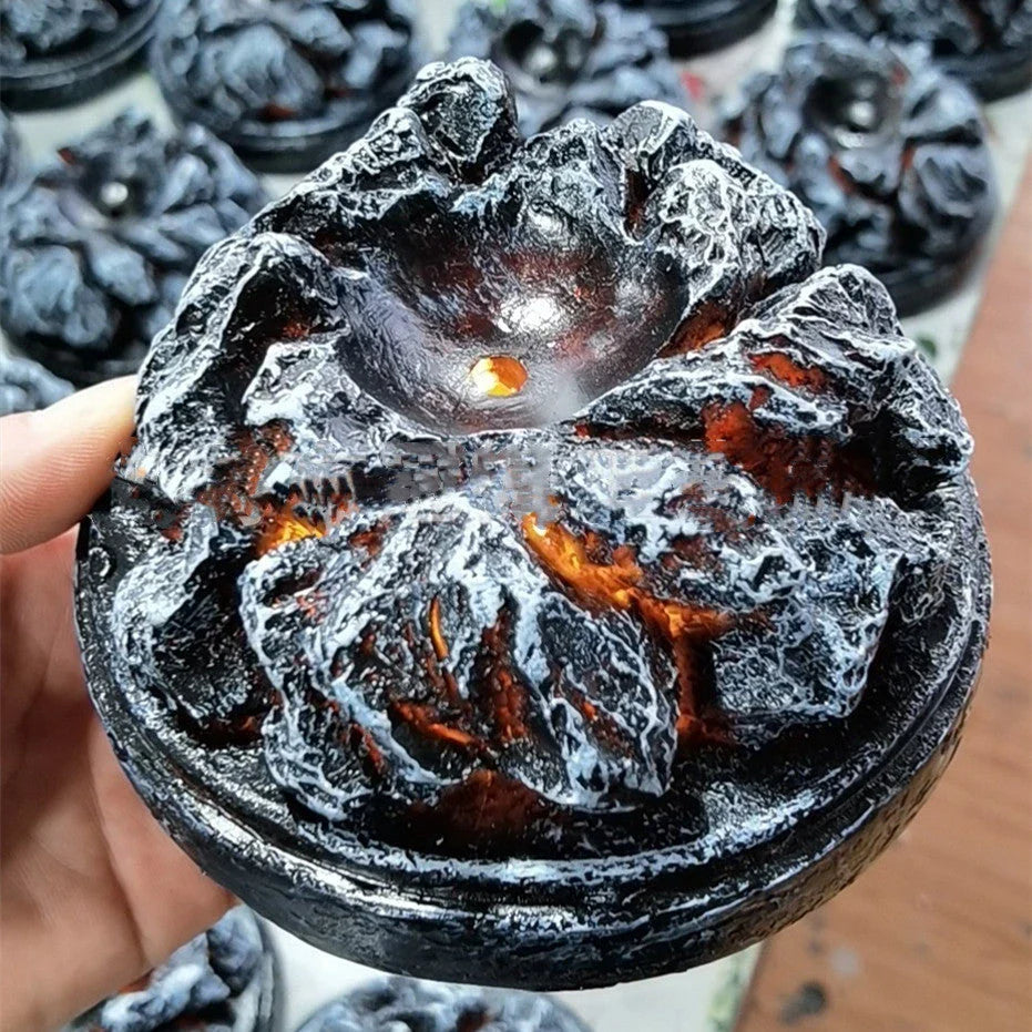 A lifelike resin dragon egg ornament with a crystal-clear, transparent design, sitting on a glowing lava-style base.