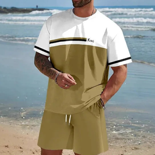 Man wearing a loose fit grey short-sleeved t-shirt and matching shorts from a summer leisure suit.