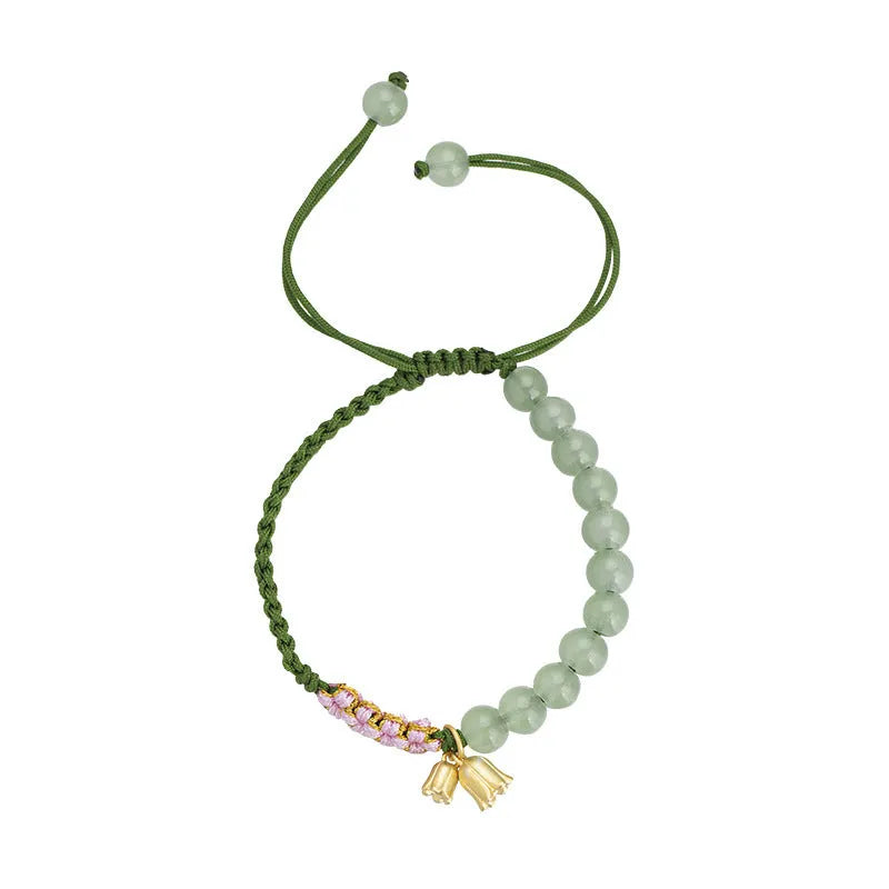 Red rope hand woven bracelet with floral design and Lily carrying strap colour