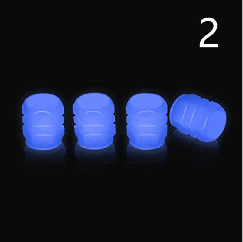 Glow-in-the-dark rubber tyre valve caps in five colour options on tyre valve stem