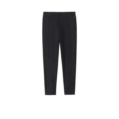 Man wearing black slim straight-leg loose fit cotton trousers with a drawstring waist