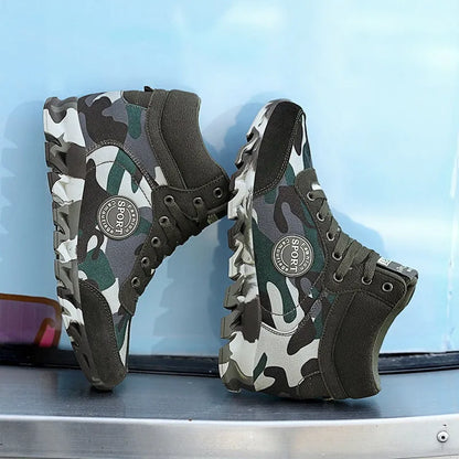 Green women's camouflage pattern canvas slip-on sneaker with a rubber sole.