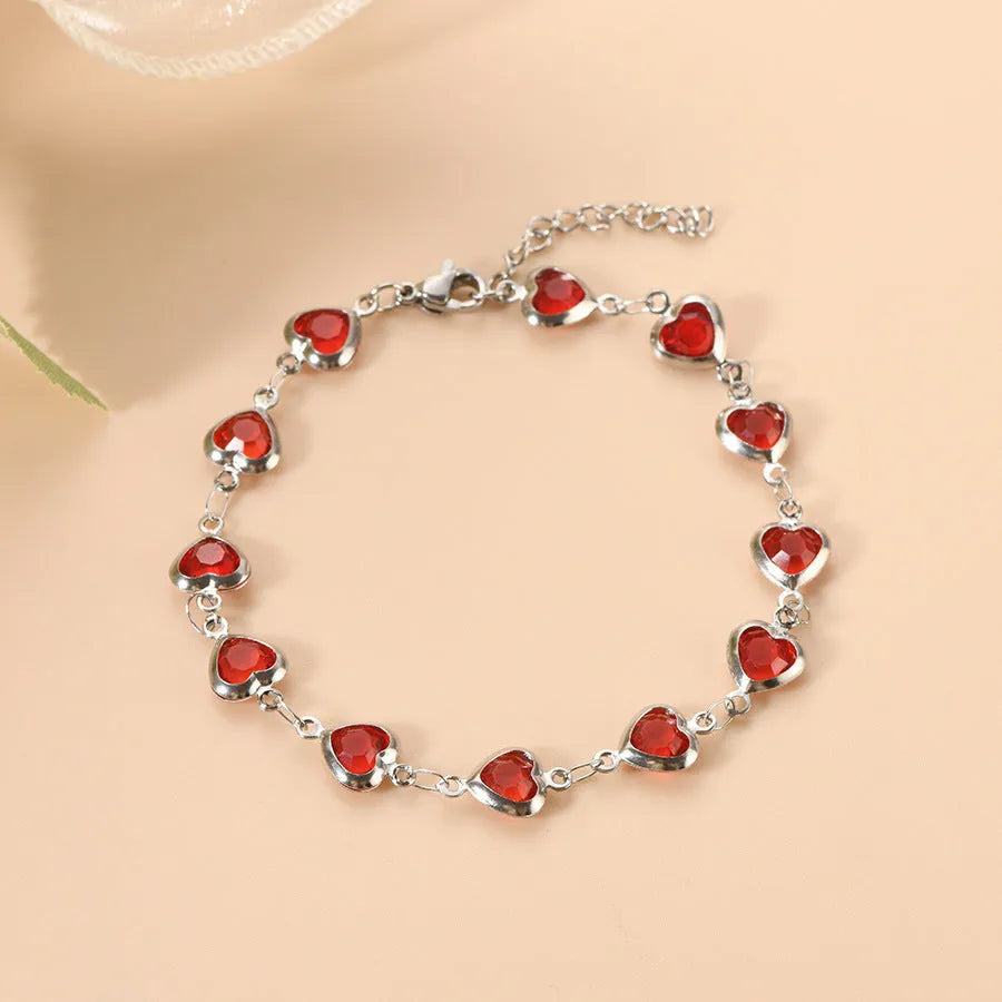 Devil's eye geometric heart bracelet in stainless steel showing colourful electroplated finish options.