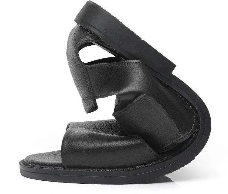 Men's brown leather Roman sandals with an open toe and rubber sole on a wooden surface.