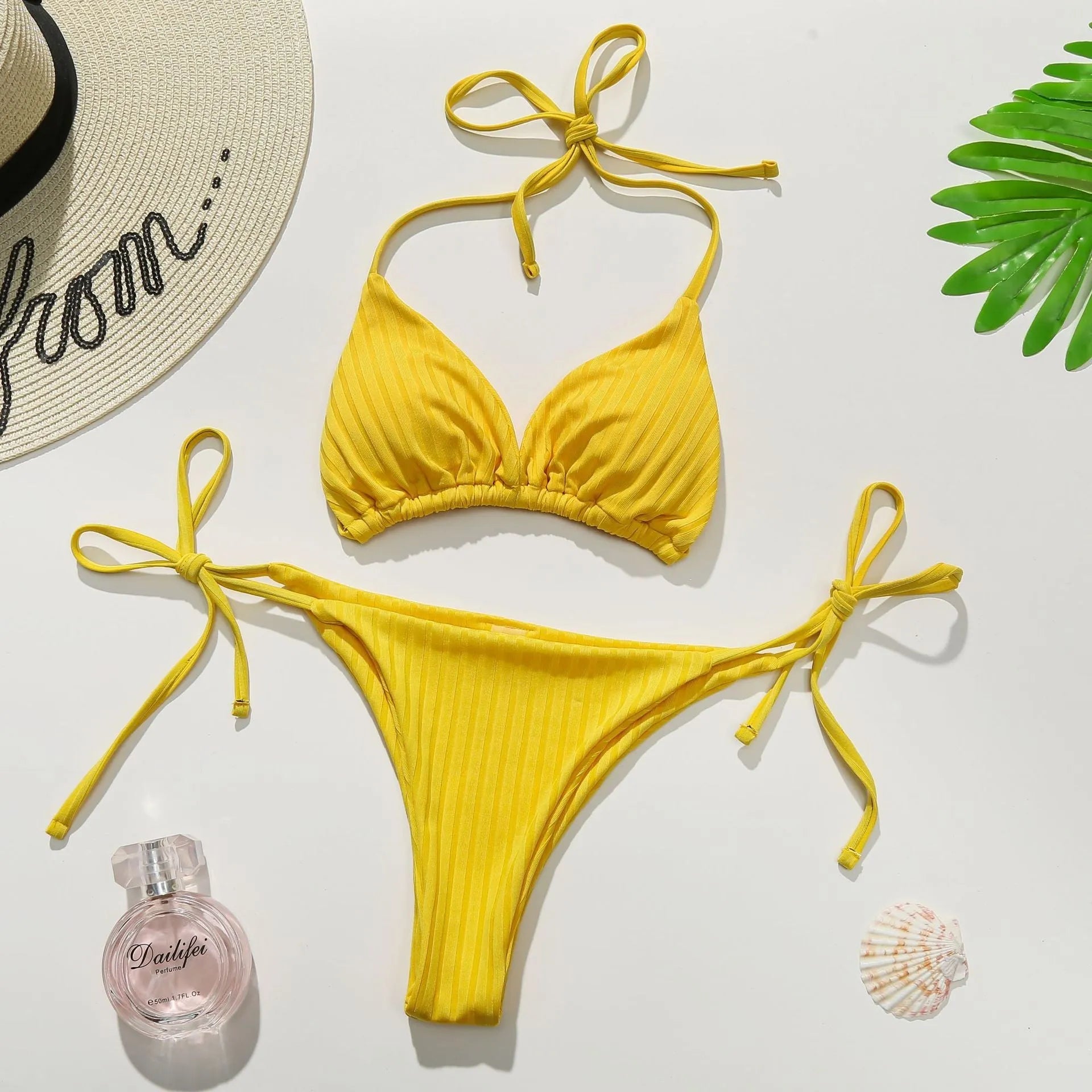 Solid colour women's bikini swimsuit with triangle banded briefs in yellow and dark green options