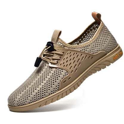 Men's black breathable mesh casual shoe with elastic band and rubber sole on a white background.