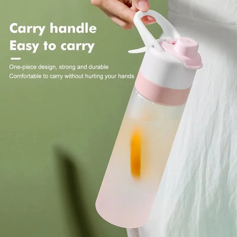 White spray water bottle with black leakproof lid and handle strap on a table